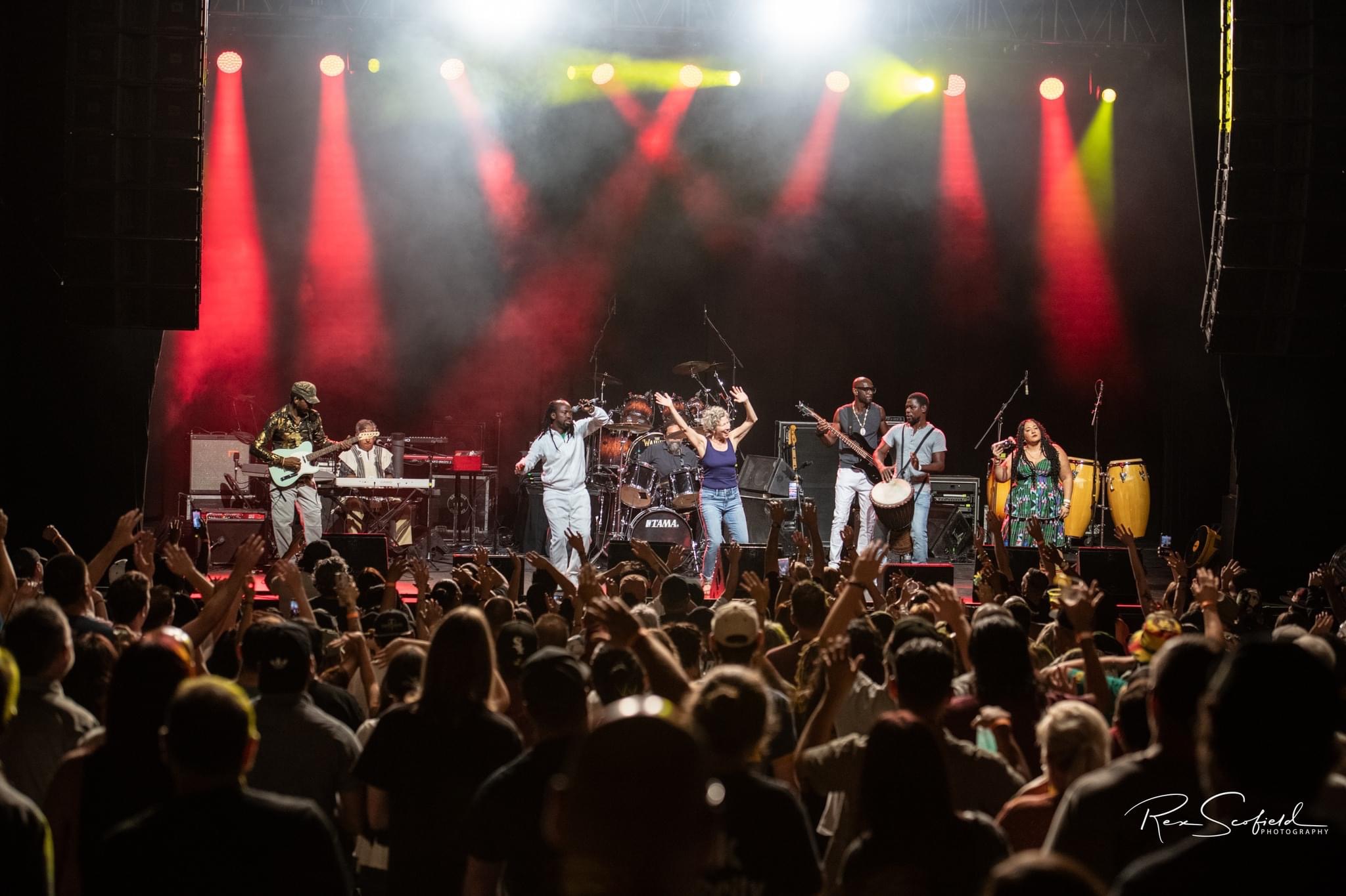 General Tchefary and musicians performing for a large audience